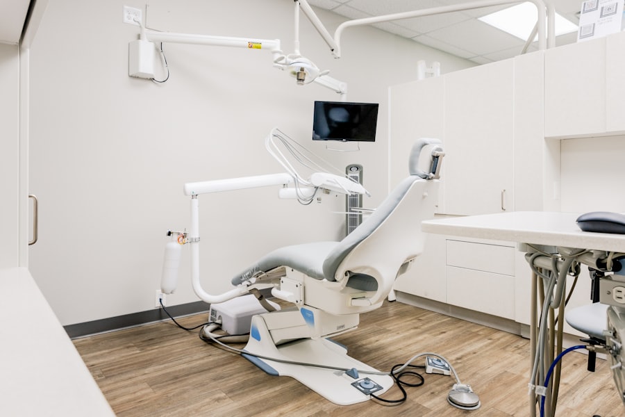 A quiet, uncluttered treatment room at Aster Dental Studio, with a pale dental chair and daylight on white walls.